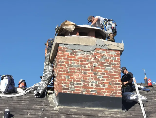 Fort Collins Chimney Sweep installing a custom chimney crown in Fort Collins, CO